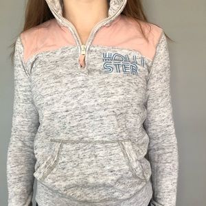 grey hollister zip up with pink shoulders